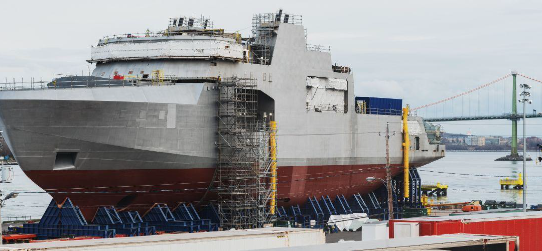 white ship in drydock covered in scaffolding